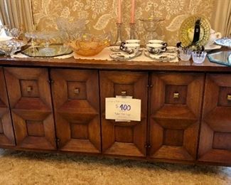 Beautiful Mid-Century Buffet in great condition. Middle section has drawers, ends have shelves.