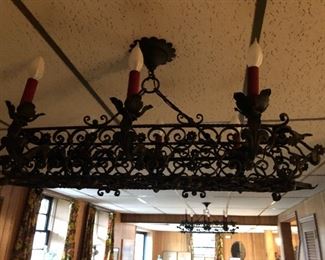 THERE IS A PAIR OF THESE WROUGHT IRON SPANISH GOTHIC. YOUR WINE CELLAR?