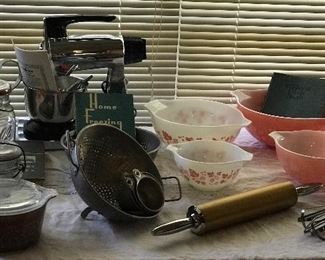 Vintage pink Pyrex nesting , chrome sunbeam mixer, interesting mirro ware style rolling pin 