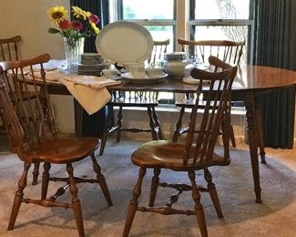 Ethan Allen dining furniture 8 chairs( 6 side, two arm) and dining table with two leaves. drop down ends let you make to square. Never without cushion pads this is in primo condition.