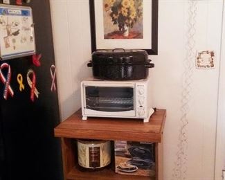 Toaster oven, rolling  cart, George Forman grill, enameled roaster pan, Crockpot.  Refrigerator  NOT FOR SALE! 