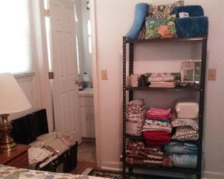 Metal shelf unit for sale with mostly new items!