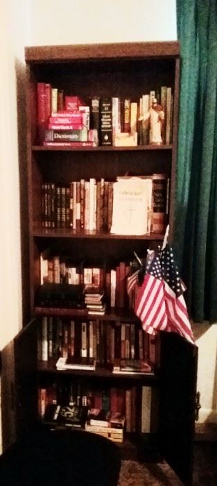 One of two bookcases for sale as well as miscellaneous books. 