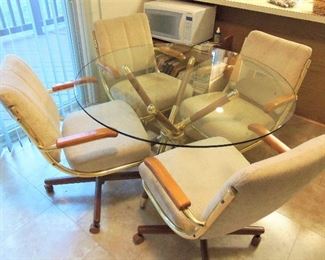 Glass top kitchen table with 4 chairs on casters