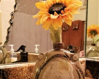 Pottery is so different in this home. The mirror is NOT for sale but come by and see this mirror in the bathroom. It will give you a great decorating idea for your own home.