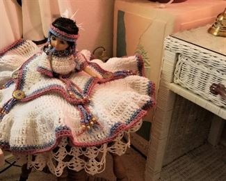 Vintage Native American doll and wicker side table with drawer