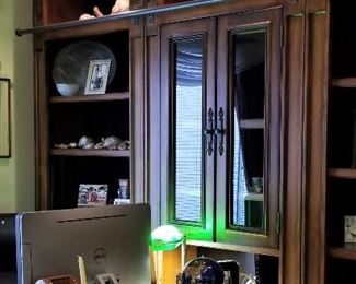 Office furniture for sale. This is beautiful! It comes apart in sections. The shelving at the end is rounded. It has glass cabinet and shelving units each side and a desk