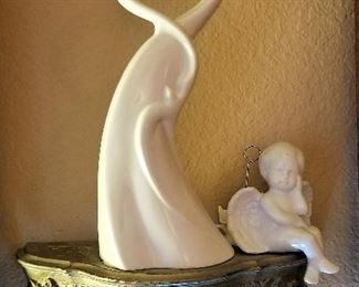 Small wall shelves and sculptures and angels flying everywhere