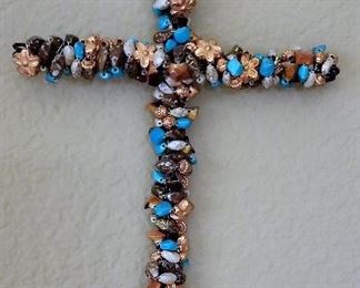 I've seen a lot of crosses but never like this cross with colored stones.