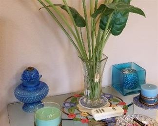 Glass console table and vase of Cally Lilies