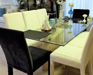 This dining table has a fabulous base. 8 chairs