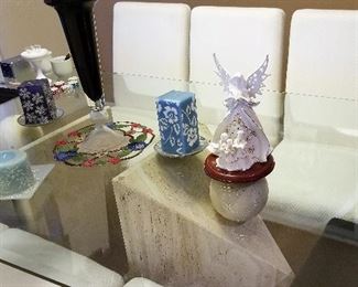 Notice the bases of the glass tables in this home. This is the dining table that has 8 chairs.