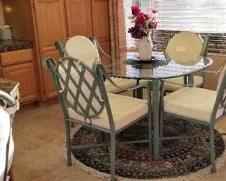Round metal and glass table and chairs