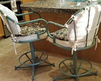 Metal armed swivel bar stools. Comfortable with the cushions and wideness of the chairs