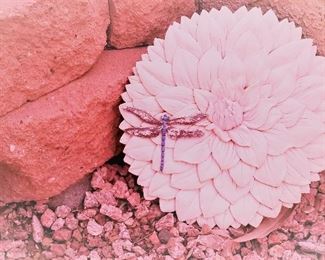 Lots of outdoor decor items. Dragonfly on flower sculptured stone.