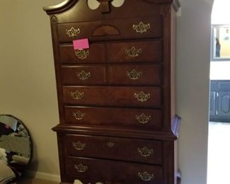 Lovely dark wood high boy chest of drawers.