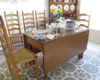 Six ladder back caned bottom chairs - drop leaf dining room table