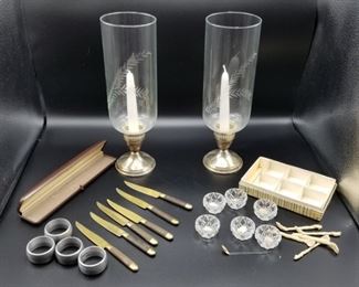 Weighted Sterling Silver Candleholders, Knives, Salt Cellars https://ctbids.com/#!/description/share/317402