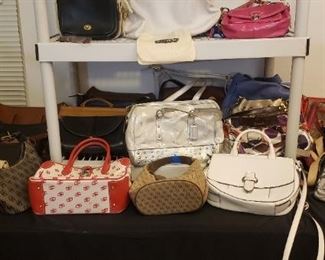 Over 35 COACH purses, some DOONEY & BOURKE purses and a MICHAEL KORS purse
