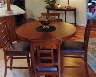 High top with 18 leaf extension and six chairs