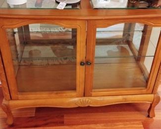 Two door glass shelved cabinet