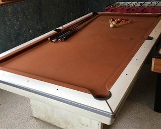 Brunswick pool table with balls and cues