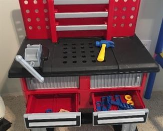 Child's plastic workbench with tools