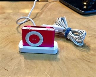 Mini i-Pod SHUFFLE, Holds 240 Songs, measures only 1.5" x 1", Works GREAT and has an awesome sound! Has charging station and earphones. 