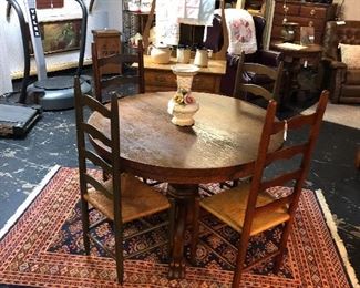 Antique Oak Table on Casters with 4 Ladder Back Cane Chairs