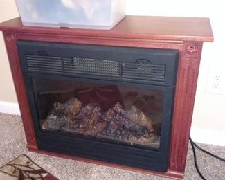 Heat surge electric fireplace 