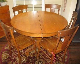 Round oak pedestal table and chairs