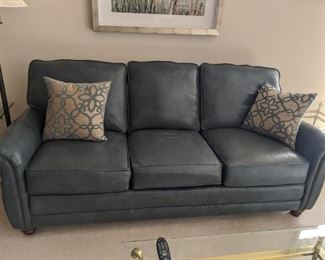 $975    Blue leather Smith Brothers sofa