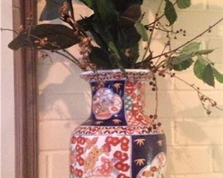 One of two Asian style vintage blue & rust -colored vases with wooden bases