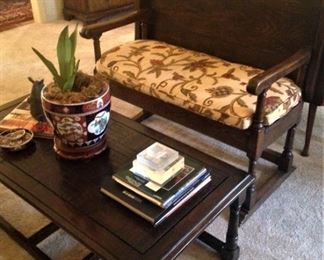 This antique settee has a back that converts to a table; great coffee table