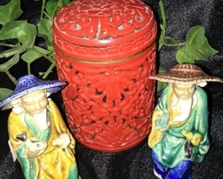 Asian mudmen and cinnabar jar