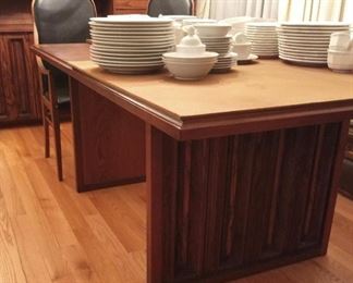 Mid Century Modern dining table by Dillingham.  Made of walnut and pecky cypress.  Comes with 2 leaves and full set of pads.  A gorgeous table in great condition.  