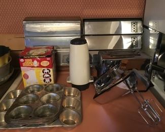 Wax/Foil Paper Dispensers, Egg Stractor,  Muffin Pans. Hand Mixer, Toaster