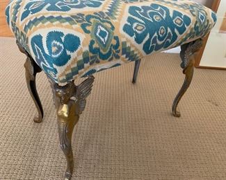 Decorative stool with brass angel figurines