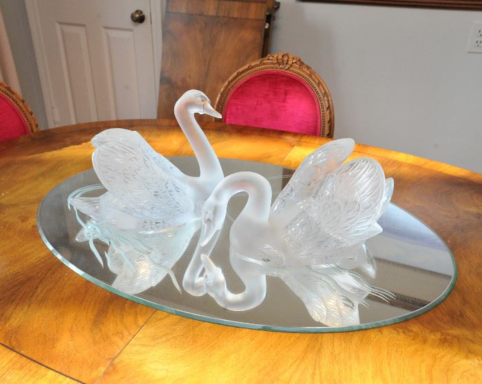 Lalique swans on mirror base. 