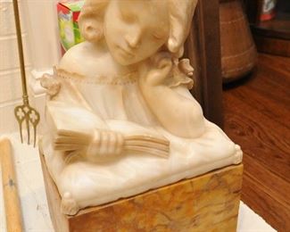 Alabaster bust of young girl reading a book on marble plinth