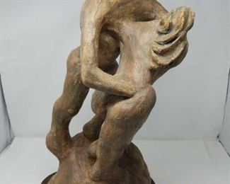 Terracotta sculpture with a wooden stand by Danielle Erem