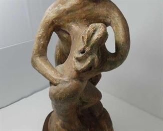 Terracotta sculpture with a wooden stand by Danielle Erem