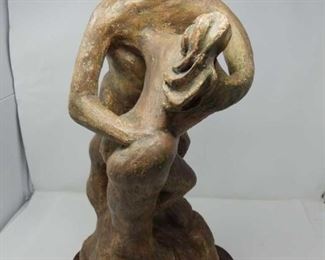 Terracotta sculpture with a wooden stand by Danielle Erem