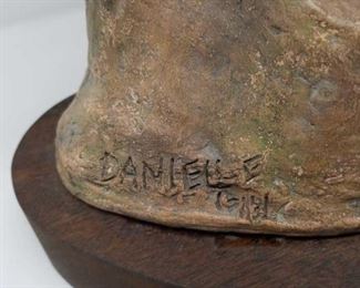 Terracotta sculpture with a wooden stand by Danielle Erem