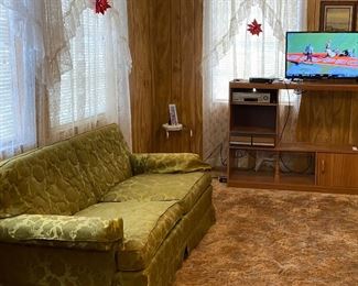 Olive Green Love Seat Satin Brocade, Entertainment Center, Corner Glass Top Side Table (Note T.V. Displayed Family Item)