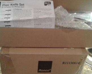Set of 25 New in Box RONCO knives and block.