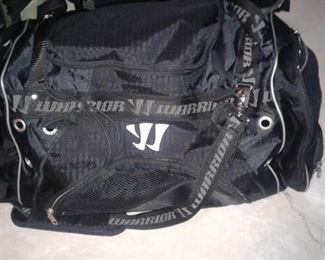 Super cool hockey gear in this multi pocketed, zipped clipped and strapped up gym bag.  