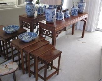 Nesting rosewood table set, with gold leaf inlays. 