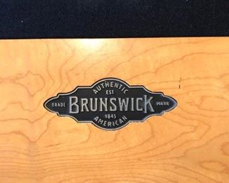 Brunswick’s contemporary and sleek Manhattan Pool Table with accessories..