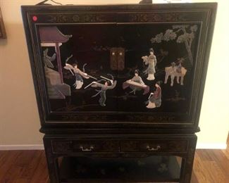 Chinoiserie swivel cabinet with raised motif